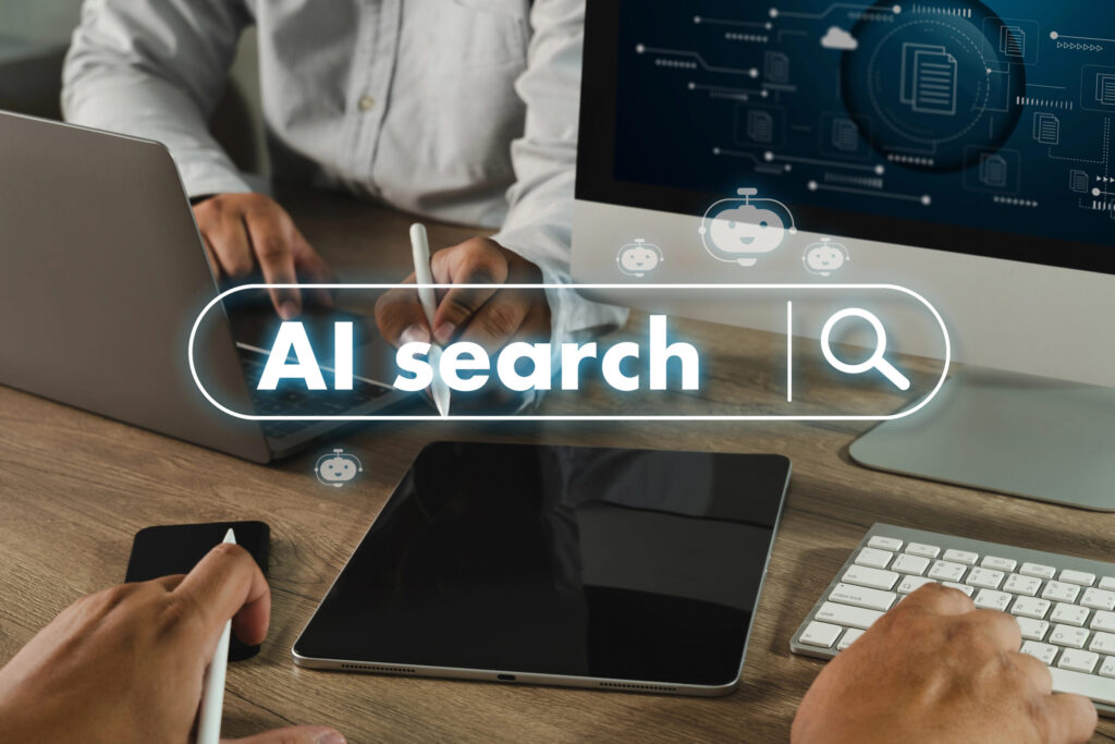 AI search suchfeld auf einem Bild welches PErsonen am Rechner zeigt